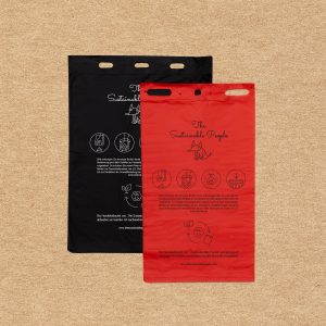 Geblockte biologisch abbaubare Hundekotbeutel in den Farben rot, schwarz und in den Größen 20x33 cm, und 25x31cm mit Blockrand und Löchern zur Aufhängung in Spender-stationen für Städte und Gemeinden